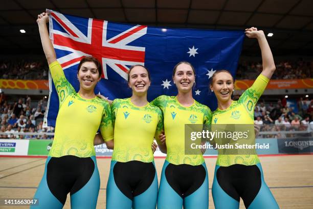 Gold Medalists, Georgia Baker, Sophie Edwards, Chloe Moran and Maeve Plouffe of Team Australia celebrate with their flag after finishing first in the...