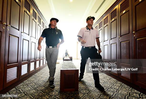 Pat Perez of 4 Aces GC and Patrick Reed of 4 Aces GC exit the locker room during day one of the LIV Golf Invitational - Bedminster at Trump National...