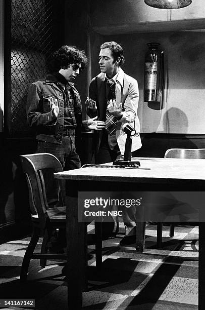 Episode 13 -- Pictured: Gilbert Gottfried as Vic Lazlo, Ray Sharkey as interrogator during the 'Filmed Confession' skit on April 11, 1981 -- Photo...