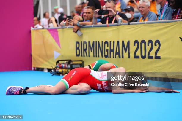 Olivia Mathias of Team Wales reacts after crossing the finish line in the Women's Individual Sprint Distance Triathlon Final on day one of the...