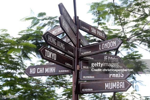 directional signs to multiple capital cities, penang hill, malaysia - kilometer stock pictures, royalty-free photos & images