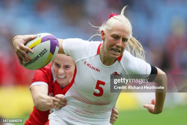 Heather Cowell of Team England scores a try during the Women's Rugby Sevens Pool A match between Team Canada and Team England on day one of the...