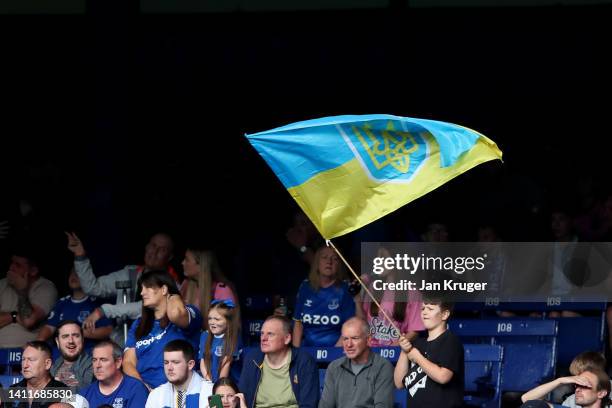 Fan waves a Ukranian flag during the Pre-Season Friendly match between Everton and Dynamo Kyiv at Goodison Park on July 29, 2022 in Liverpool,...