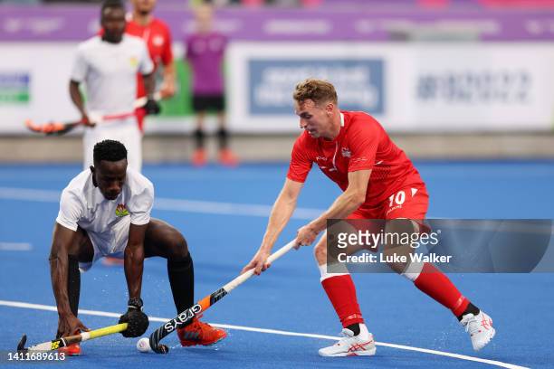 Christopher Griffiths of Team England competes with Charles Abbiw of Team Ghana during the Men's Hockey - Pool B match between England and Ghana on...