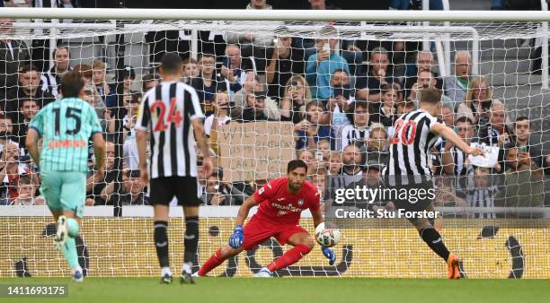 Newcastle striker Chris Wood scores the opening goal past Marco Sportiello from the penalty spot during the Pre Season friendly match between...