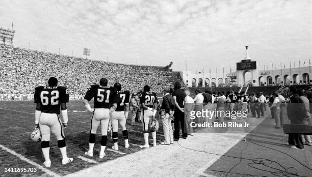 Los Angeles Raiders line up on sideline at Los Angeles Memorial Coliseum prior to AFC Playoff game, January 15, 1983 in Los Angeles, California.