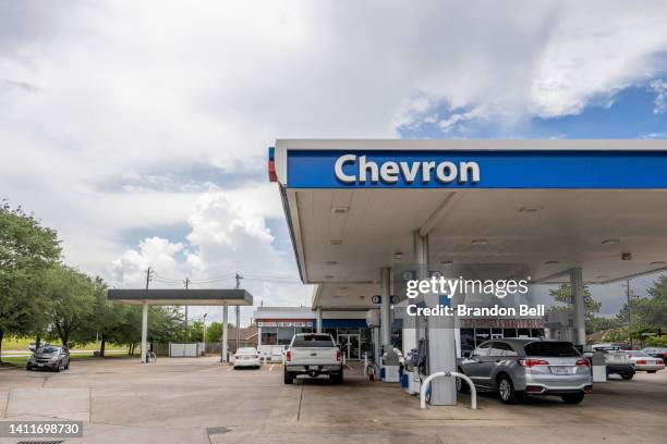 Cars parked at Chevron gas station pumps are seen on July 29, 2022 in Houston, Texas. Exxon and Chevron posted record high earnings during the second...