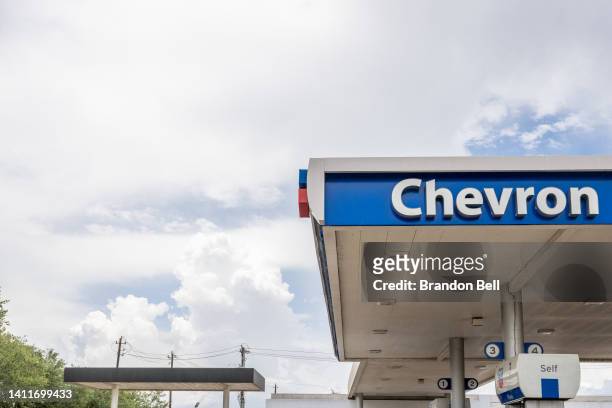 Chevron gas station sign is seen on July 29, 2022 in Houston, Texas. Exxon and Chevron posted record high earnings during the second quarter of 2022...