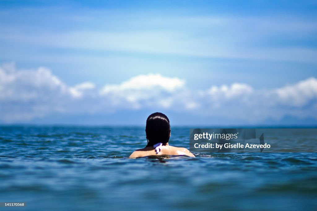 Woman swimming in sea