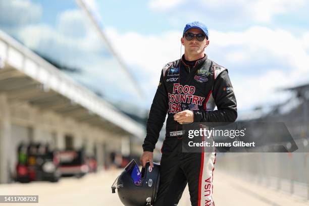 Parker Kligerman, driver of the Pro Master Chevrolet, looks on during practice for the NASCAR Xfinity Series Pennzoil 150 at the Brickyard at...