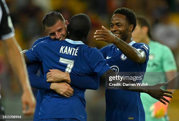 Ngolo Kante of Chelsea celebrates with teammates Mason Mount and Raheem Sterling after scoring their team's first goal during the pre-season friendly...