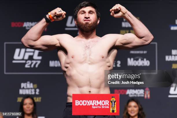 Magomed Ankalaev of Russia poses on the scale during the UFC 277 ceremonial weigh-in at American Airlines Center on July 29, 2022 in Dallas, Texas.