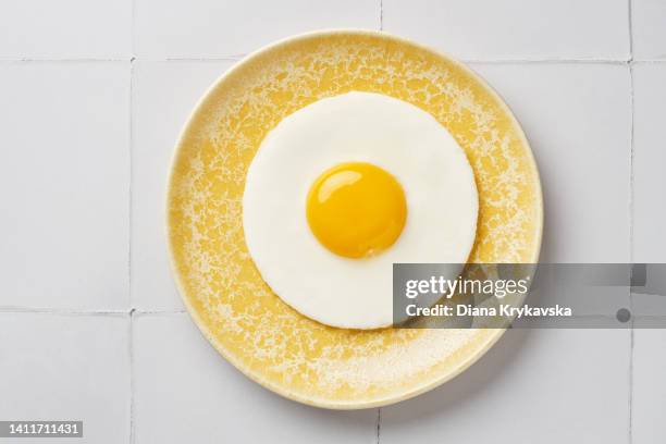 one fried egg - stekt ägg bildbanksfoton och bilder