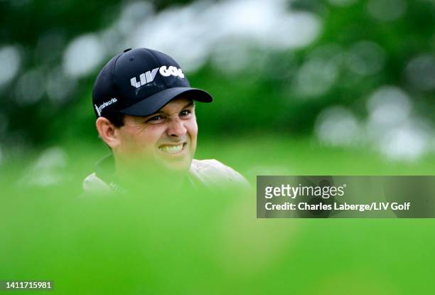 Patrick Reed of 4 Aces GC reacts after hitting his tee shot on the 13th hole during day one of the LIV Golf Invitational - Bedminster at Trump...