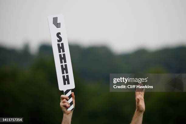 Paddle sign reading "SHHHH" is displayed during day one of the LIV Golf Invitational - Bedminster at Trump National Golf Club Bedminster on July 29,...