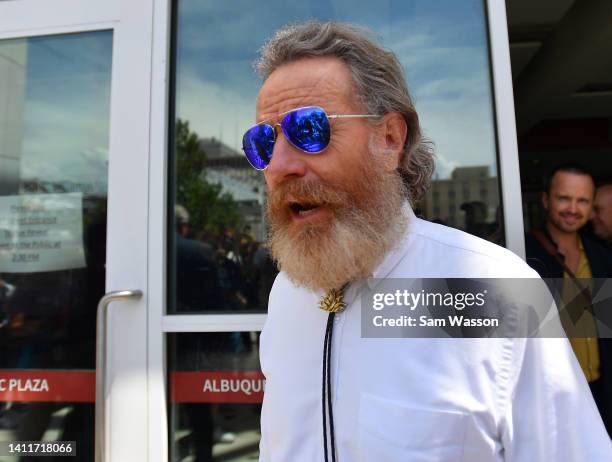 Actor Bryan Cranston greets fans during an unveiling ceremony of bronze statues depicting television characters Walter White, played by actor Bryan...