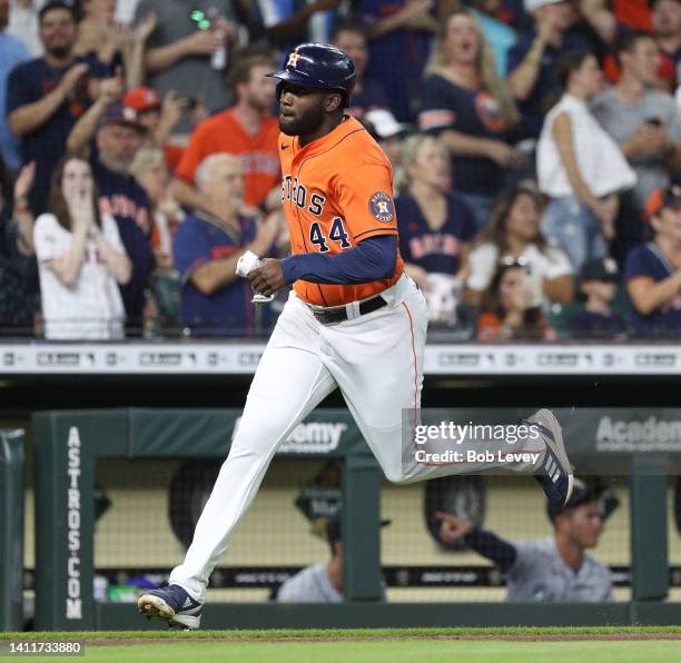 Yordan Alvarez of the Houston Astros scores on a double by Alex Bregman in the third inning against the Seattle Mariners at Minute Maid Park on July...
