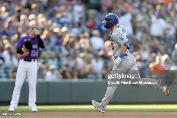 Will Smith of the Los Angeles Dodgers circles the bases after hitting a two RBI home run against the Colorado Rockies in the first inning at Coors...