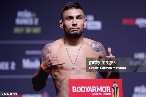 Alex Perez poses on the scale during the UFC 277 ceremonial weigh-in at American Airlines Center on July 29, 2022 in Dallas, Texas.