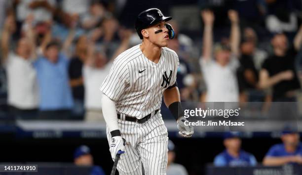 Aaron Judge of the New York Yankees watches the flight of his eighth inning grand slam home run against the Kansas City Royals at Yankee Stadium on...
