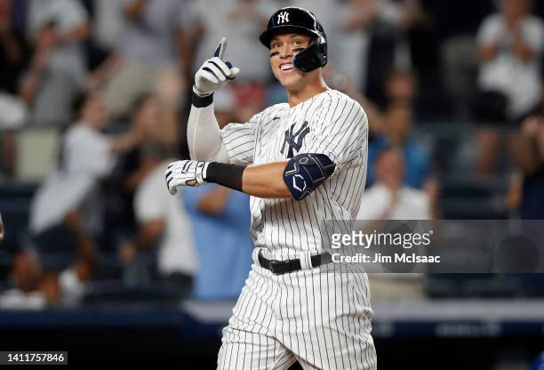 Aaron Judge of the New York Yankees reacts after his eighth inning grand slam home run against the Kansas City Royals at Yankee Stadium on July 29,...