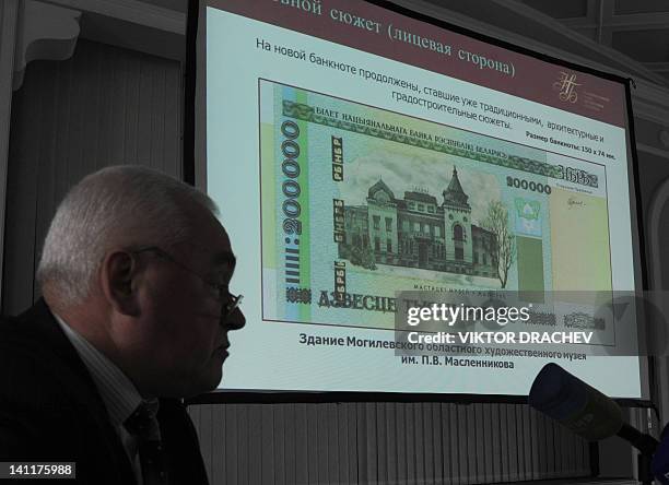 New 200,000 Belarus ruble note is displayed on a big screen during the note's presentation in the Belarusian National Bank headquarters in Minsk, on...