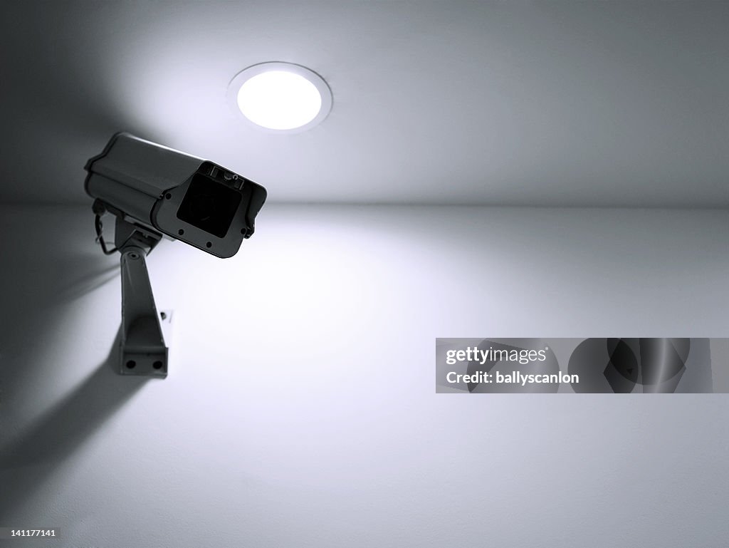 Surveillance camera on wall indoors