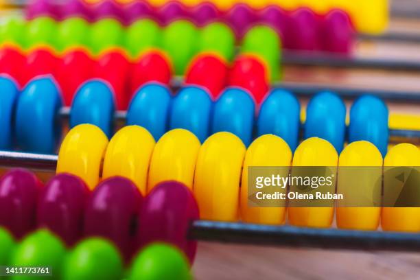 multi colored abacus. - multiplizieren stock-fotos und bilder