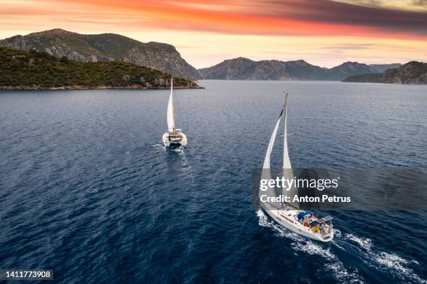 yacht with white sails at sea at sunset. luxury vacation at sea, yachting in croatia. - region dalmatien kroatien stock-fotos und bilder