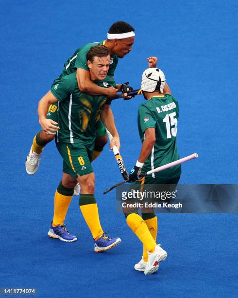 Connor Beauchamp of Team South Africa celebrates after scoring their sides first goal with team mates Ryan Julius and Dayaan Cassiem of Team South...