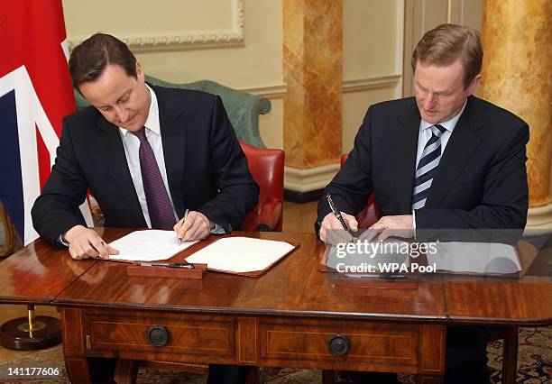 British Prime Minister David Cameron and Taoiseach Enda Kenny sign a 10 year British and Irish Relations Joint Statement at 10 Downing Street on...