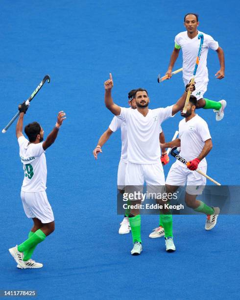 Rizwan Ali of Team Pakistan celebrates after scoring their sides first goal during the Men's Hockey Pool A match between South Africa and Pakistan on...