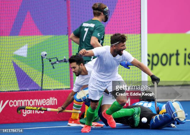 Ahmad Nadeem of Team Pakistan celebrates after Afraz of Team Pakistan scores their sides second goal during the Men's Hockey Pool A match between...