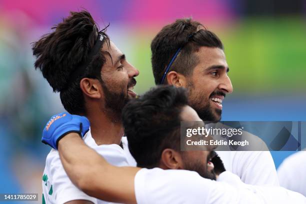 Afraz of Team Pakistan celebrates with team mates after scoring their sides second goal during the Men's Hockey Pool A match between South Africa and...