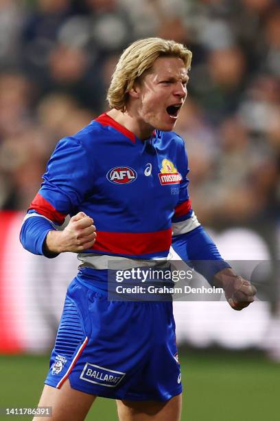 Cody Weightman of the Bulldogs celebrates kicking a goal during the round 20 AFL match between the Geelong Cats and the Western Bulldogs at GMHBA...