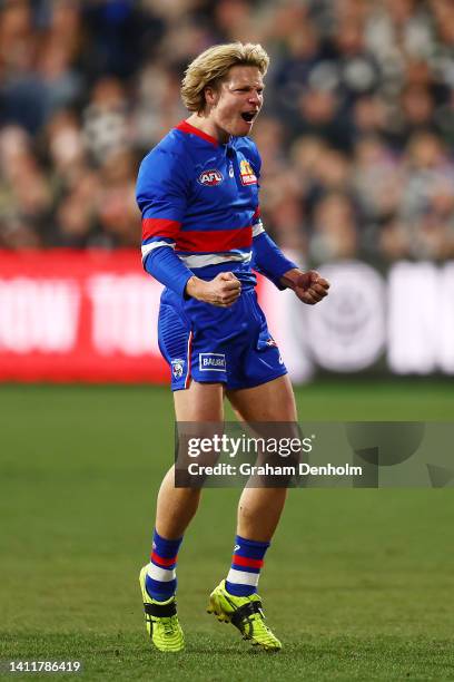 Cody Weightman of the Bulldogs celebrates kicking a goal during the round 20 AFL match between the Geelong Cats and the Western Bulldogs at GMHBA...