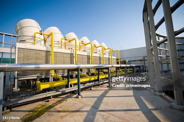 sets of cooling towers in conditioning systems - compressor stockfoto's en -beelden