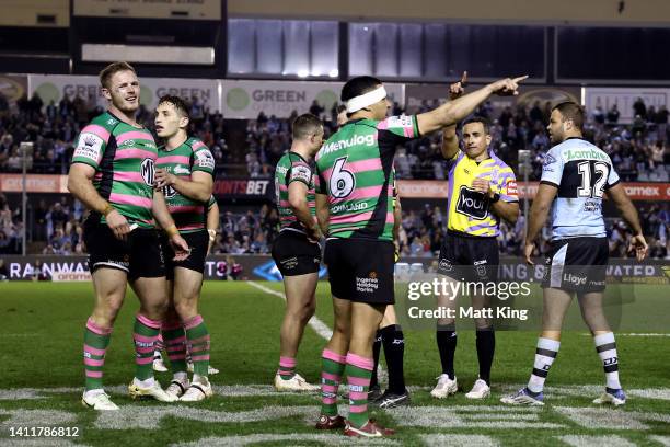 Tom Burgess of the Rabbitohs is sent off by referee Gerard Sutton during the round 20 NRL match between the Cronulla Sharks and the South Sydney...