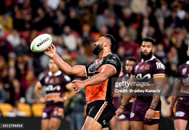 Zane Musgrove of the Tigers celebrates scoring a try during the round 20 NRL match between the Brisbane Broncos and the Wests Tigers at Suncorp...