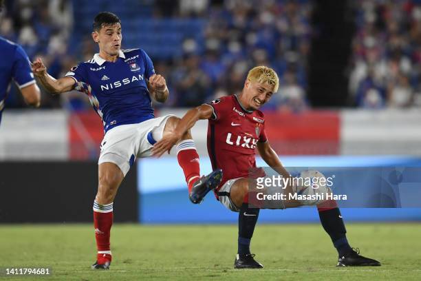 Yuma Suzuki of Kashima Antlers and Eduardo of Yokohama F.Marinos compete for the ball celebrate the first goal during the J.LEAGUE Meiji Yasuda J1...