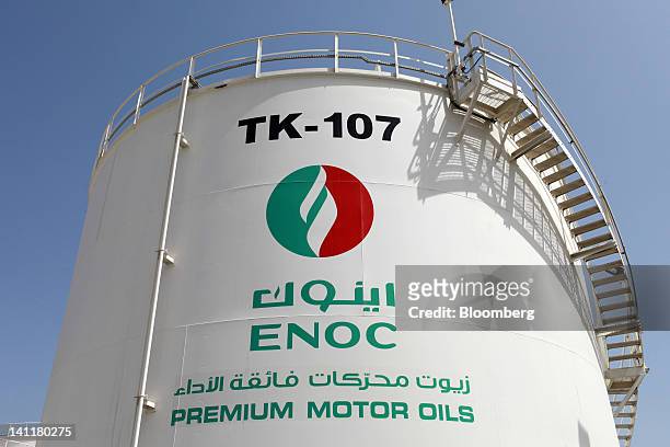 An ENOC-branded storage tank containing "Premium motor oils" stands at the Emirates National Oil Co. Lubricants and grease manufacturing plant in...
