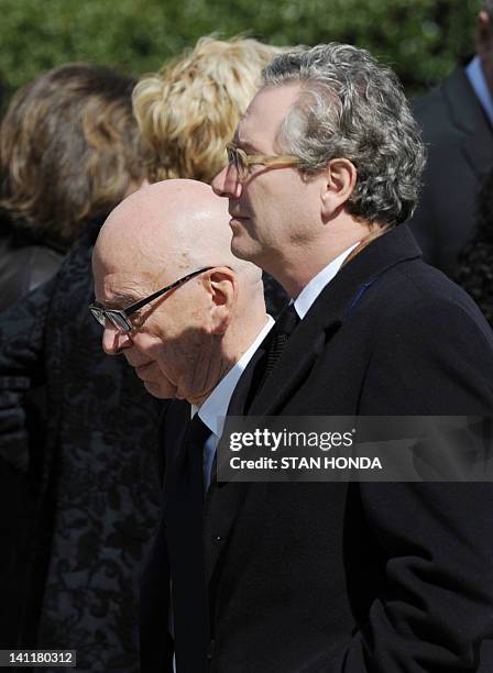 Rupert Murdoch , Chairman and CEO of News Corp. And John Witherow , Editor of the Sunday Times of London, leave the funeral of slain Times of London...