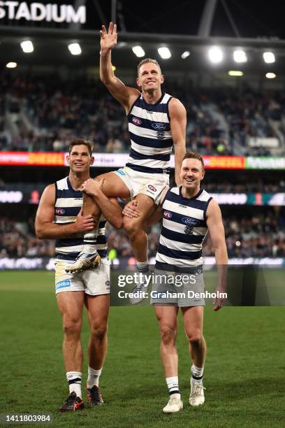 Joel Selwood of the Cats is chaired from the pitch following his 350th match in the round 20 AFL match between the Geelong Cats and the Western...