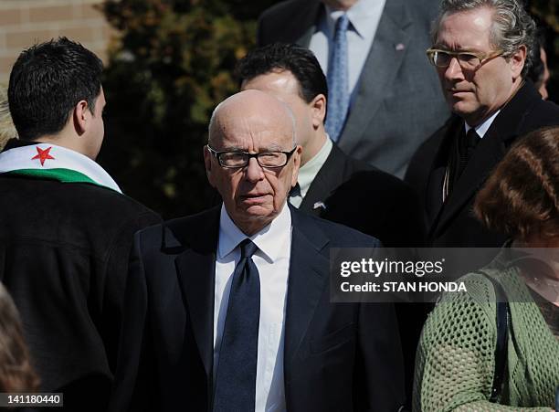 Rupert Murdoch , Chairman and CEO of News Corp. And John Witherow , Editor of the Sunday Times of London, leave the funeral of slain Times of London...