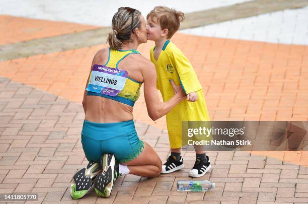 Eloise Wellings of Team Australia of Team Australia celebrates with their Son after finishing in the Women's Marathon on day two of the Birmingham...