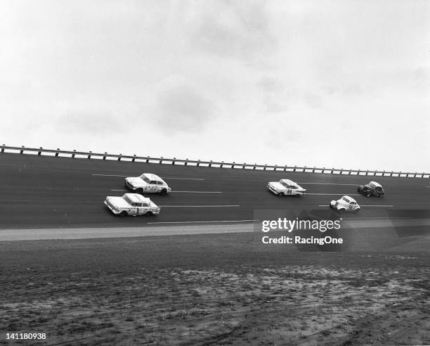 February 13, 1960: Elmo Langley in a 1957 Ford leads Bob Rosselle's 1938 Chevrolet , the 1957 Chevrolet of Earl Balmer , Wally Dallenbach in a 1937...