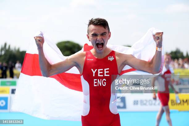 Alex Yee of Team England celebrates after winning the Gold medal during the Men's Individual Sprint Distance Triathlon Final on day one of the...