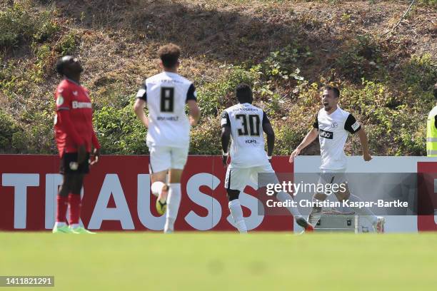 Luca Schnellbacher of SV 07 Elversberg celebrates after scoring his team`s third goal with teammate Kevin Koffi of SV 07 Elversberg during the DFB...