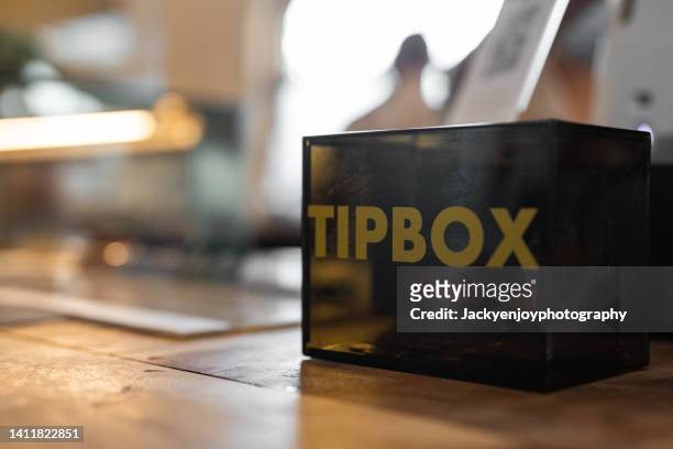 tipbox in cafe - gratitude jar stock pictures, royalty-free photos & images