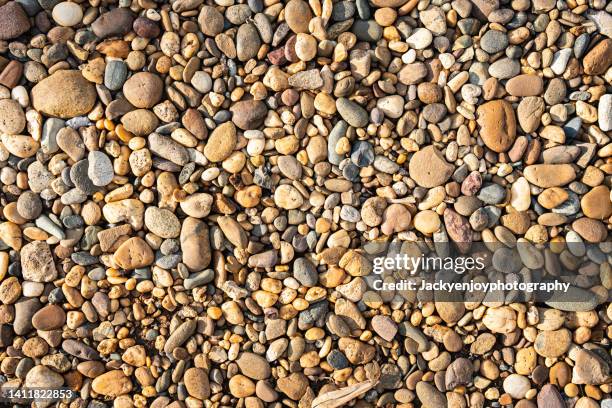 pebble stones background texture - cobblestone texture stock pictures, royalty-free photos & images